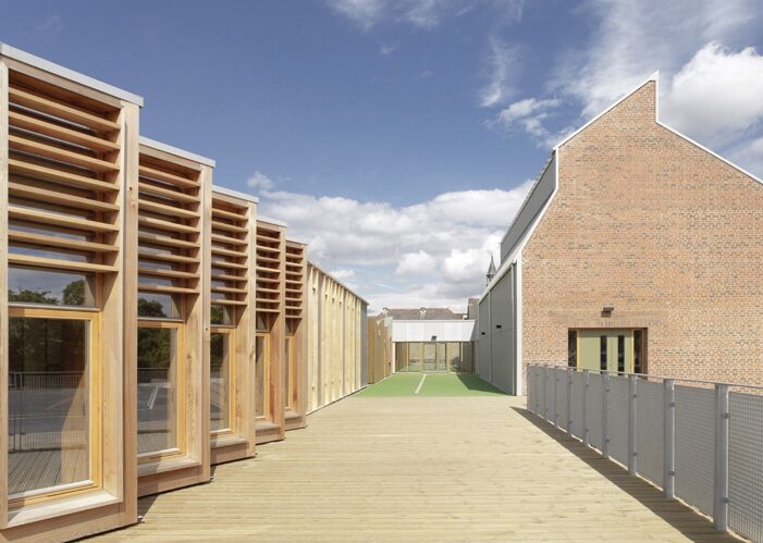 Sarah Wigglesworth's design of three linear buildings as three cross-linked terraces of houses divided by two ‘streets’ has powerful cultural significance