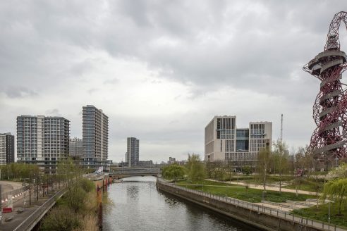 UCL-East-both-buildings-across-river-grey-skies-stanton-williams-lds-crop-492x328.jpg